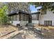 Outdoor patio with chairs, lounge seating, a small table, and lush tree coverage at 913 Moss Ln, Winter Park, FL 32789