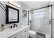Modern bathroom with sleek fixtures, a marble tiled shower, and a stylish vanity at 913 Moss Ln, Winter Park, FL 32789
