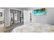 Bright bedroom showcasing ample closet space and light flooring that leads to a connecting room at 913 Moss Ln, Winter Park, FL 32789