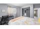 Cozy bedroom with a desk and closet storage with built in shelves, enhancing space at 913 Moss Ln, Winter Park, FL 32789