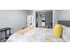 Cozy bedroom with closet storage and a patterned comforter with yellow accents at 913 Moss Ln, Winter Park, FL 32789