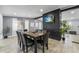 Spacious dining room with a rustic wooden table, seating for eight, and a decorative black brick accent wall at 913 Moss Ln, Winter Park, FL 32789