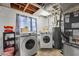 Laundry room with new washer and dryer units, updated plumbing, and painted walls at 913 Moss Ln, Winter Park, FL 32789