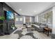 Bright living room featuring gray walls, large windows, and a comfortable gray sectional sofa at 913 Moss Ln, Winter Park, FL 32789