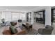 Cozy living room leading to a dining area, offering a relaxed space with plenty of natural light and stylish decor at 913 Moss Ln, Winter Park, FL 32789
