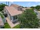 A charming home featuring a tile roof, mature landscaping, and well-manicured lawn at 939 Glen Abbey Cir, Winter Springs, FL 32708