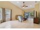Spacious living room with high ceilings, tile flooring, and sliding glass doors to the lanai at 939 Glen Abbey Cir, Winter Springs, FL 32708
