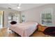 Bright main bedroom with sliding glass doors and hardwood floors for a light and airy feel at 939 Glen Abbey Cir, Winter Springs, FL 32708