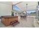 Spacious screened porch with a hot tub and dining area, perfect for entertaining at 939 Glen Abbey Cir, Winter Springs, FL 32708