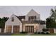 Stunning two-story modern home featuring clean lines, a brick facade and an attached two-car garage at 985 Lincoln Cir, Winter Park, FL 32789