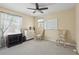 Well-lit room featuring neutral walls, a ceiling fan, and carpeted floors, creating a cozy and inviting atmosphere at 108 Sagecrest Dr, Ocoee, FL 34761