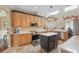 Spacious kitchen with stainless steel appliances, granite countertops, a center island, and plenty of cabinetry at 108 Sagecrest Dr, Ocoee, FL 34761