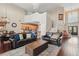 Inviting living room with high ceilings, hardwood floors, and comfortable seating under a chandelier, next to the kitchen at 108 Sagecrest Dr, Ocoee, FL 34761