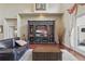 Cozy living room with a large entertainment center, hardwood floors, and access to a patio at 108 Sagecrest Dr, Ocoee, FL 34761
