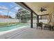 Inviting outdoor space featuring a screened pool, covered patio, and comfortable seating, perfect for entertaining at 108 Sagecrest Dr, Ocoee, FL 34761