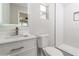 Modern bathroom with white vanity, sleek faucet, and walk-in shower with glass door at 1105 Valencia Ave, Haines City, FL 33844