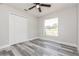 Neat bedroom with a closet, ceiling fan, and light gray walls at 1105 Valencia Ave, Haines City, FL 33844