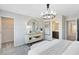 Bedroom with a stylish dresser and ensuite bathroom entrance at 11328 Blue Bay Dr, Orlando, FL 32832