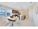 Modern dining area with island, with abundant natural light and neutral tones at 11328 Blue Bay Dr, Orlando, FL 32832