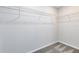 A walk-in closet with wire shelving and gray carpeting, offering ample storage space at 11328 Blue Bay Dr, Orlando, FL 32832