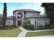 Charming two-story home with a well-manicured lawn and inviting front entrance at 11994 Mckinnon Rd, Windermere, FL 34786