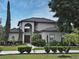 Charming two-story home with a well-manicured lawn and inviting front entrance at 11994 Mckinnon Rd, Windermere, FL 34786