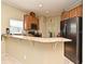 Kitchen featuring stainless steel appliances, granite countertops, and wood cabinets at 11994 Mckinnon Rd, Windermere, FL 34786