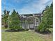 Outdoor view of lush landscaping and decorative bushes near the screened in lanai at 11994 Mckinnon Rd, Windermere, FL 34786