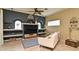 Cozy living room with built-in shelving, neutral color palette, and comfortable seating at 11994 Mckinnon Rd, Windermere, FL 34786