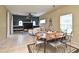 Open-concept living room with a dining area, tile floors, and modern decor at 11994 Mckinnon Rd, Windermere, FL 34786