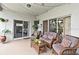 Covered patio with comfortable seating and string lights for a relaxing outdoor space at 11994 Mckinnon Rd, Windermere, FL 34786