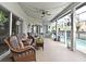 Relaxing outdoor patio area with overhead lights, furniture, and a hammock to enjoy by the pool at 11994 Mckinnon Rd, Windermere, FL 34786