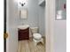 A cozy bathroom featuring a wood floor, vanity with sink and bath with shower at 12381 Antonio Cir, Orlando, FL 32826