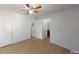 Empty bedroom with wood-look floors and doorways leading to other rooms at 12381 Antonio Cir, Orlando, FL 32826