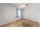 Bright bedroom with light wood floors, window, and ceiling fan at 12381 Antonio Cir, Orlando, FL 32826