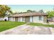 Charming duplex featuring a well-maintained lawn and a private driveway at 12381 Antonio Cir, Orlando, FL 32826