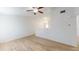 Open concept living room is brightened by vaulted ceilings and features modern tile flooring at 12381 Antonio Cir, Orlando, FL 32826