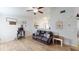 Open concept living room is decorated with tile floors and a decorative ceiling fan at 12381 Antonio Cir, Orlando, FL 32826