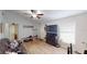 Inviting living room with wood-look floors, a large TV, and casual furnishings at 12381 Antonio Cir, Orlando, FL 32826