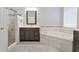 Bright bathroom with a walk in shower, soaking tub, vanity and tiled floor at 12411 Scarlett Sage Ct, Winter Garden, FL 34787