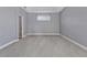 This carpeted bedroom has neutral colored walls and a source of natural light at 12411 Scarlett Sage Ct, Winter Garden, FL 34787