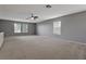 Bonus room with cabinets, neutral carpet, and windows at 12411 Scarlett Sage Ct, Winter Garden, FL 34787