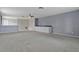 Bonus room with cabinets, neutral carpet, and windows at 12411 Scarlett Sage Ct, Winter Garden, FL 34787