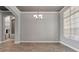 Elegant dining area with hardwood floors, decorative chandelier, and ample natural light at 12411 Scarlett Sage Ct, Winter Garden, FL 34787