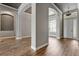 Grand foyer showcasing arched doorways, a light-filled entryway, and hardwood floors for a welcoming first impression at 12411 Scarlett Sage Ct, Winter Garden, FL 34787