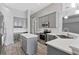 Modern kitchen with gray cabinets, stainless steel appliances, an island, and a subway tile backsplash at 12411 Scarlett Sage Ct, Winter Garden, FL 34787