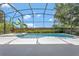 Screened-in pool with tropical landscaping at 12411 Scarlett Sage Ct, Winter Garden, FL 34787