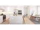 Bright, white kitchen featuring an island with seating, stainless steel appliances, and modern cabinetry at 12536 Westhaven Oak Dr # 111, Winter Garden, FL 34787