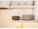 White shelves display dinnerware and plates, complemented by minimalist tile at 12536 Westhaven Oak Dr # 111, Winter Garden, FL 34787