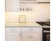 Clean white kitchen featuring sleek cabinets and countertops with modern hardware at 12536 Westhaven Oak Dr # 111, Winter Garden, FL 34787